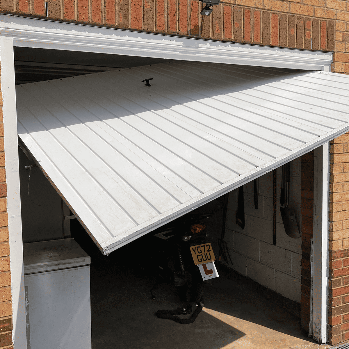 Up and over garage door being repaired